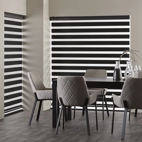 Black and white zebra blinds in a dining room.