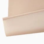 Close-up of a light beige blackout blind fabric