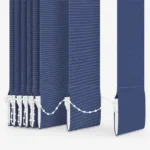 Close-up of blue vertical blind slats and bottom chain