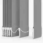 Close-up of grey vertical blind slats and bottom chain