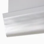 Close-up of the smooth, reflective silver blackout blind