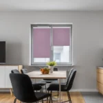 Lilac blackout roller blinds mounted on a window in a modern kitchen