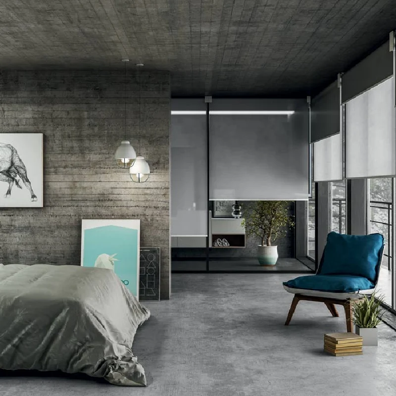 Minimalist grey roller blinds in a modern industrial-style bedroom