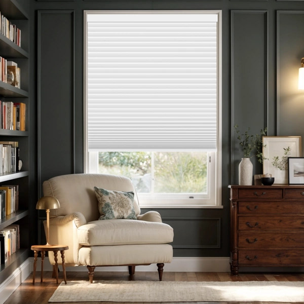 White pleated blinds in a dark-walled home office.