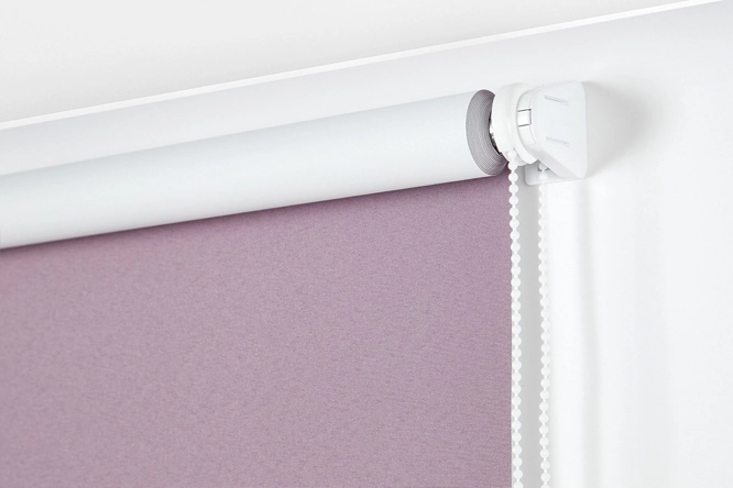 bracket and beaded chain attached to a lilac blackout roller blind.