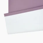 close-up of lilac blackout blind fabric featuring a white thermal backing.