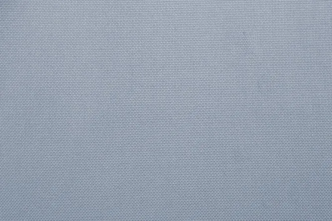 high-detail close-up of the denim blue fabric's woven texture.