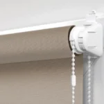 mounting bracket and beaded chain attached to a latte blackout roller blind.